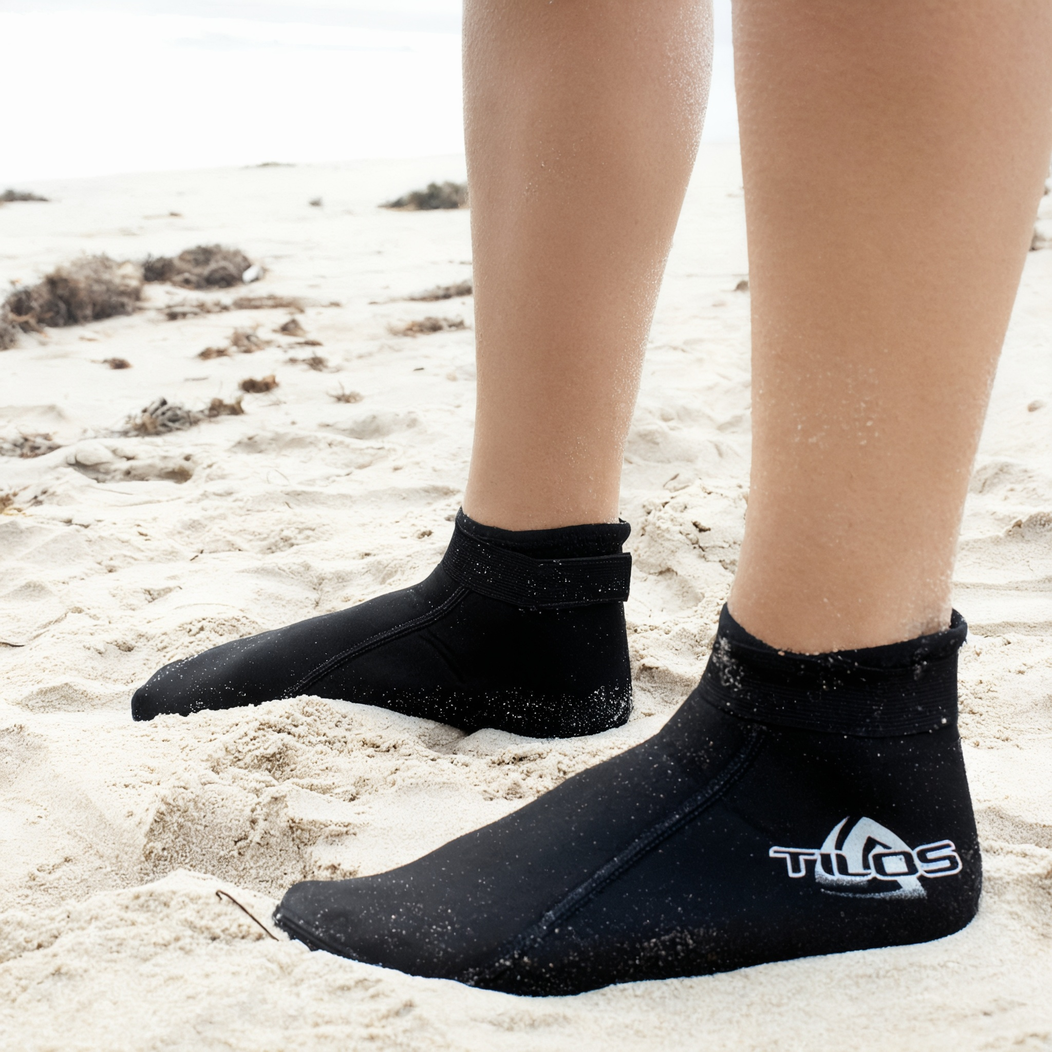 Tilos 2mm Mid-High Top Socks in black — water sock showing neoprene upper and sole