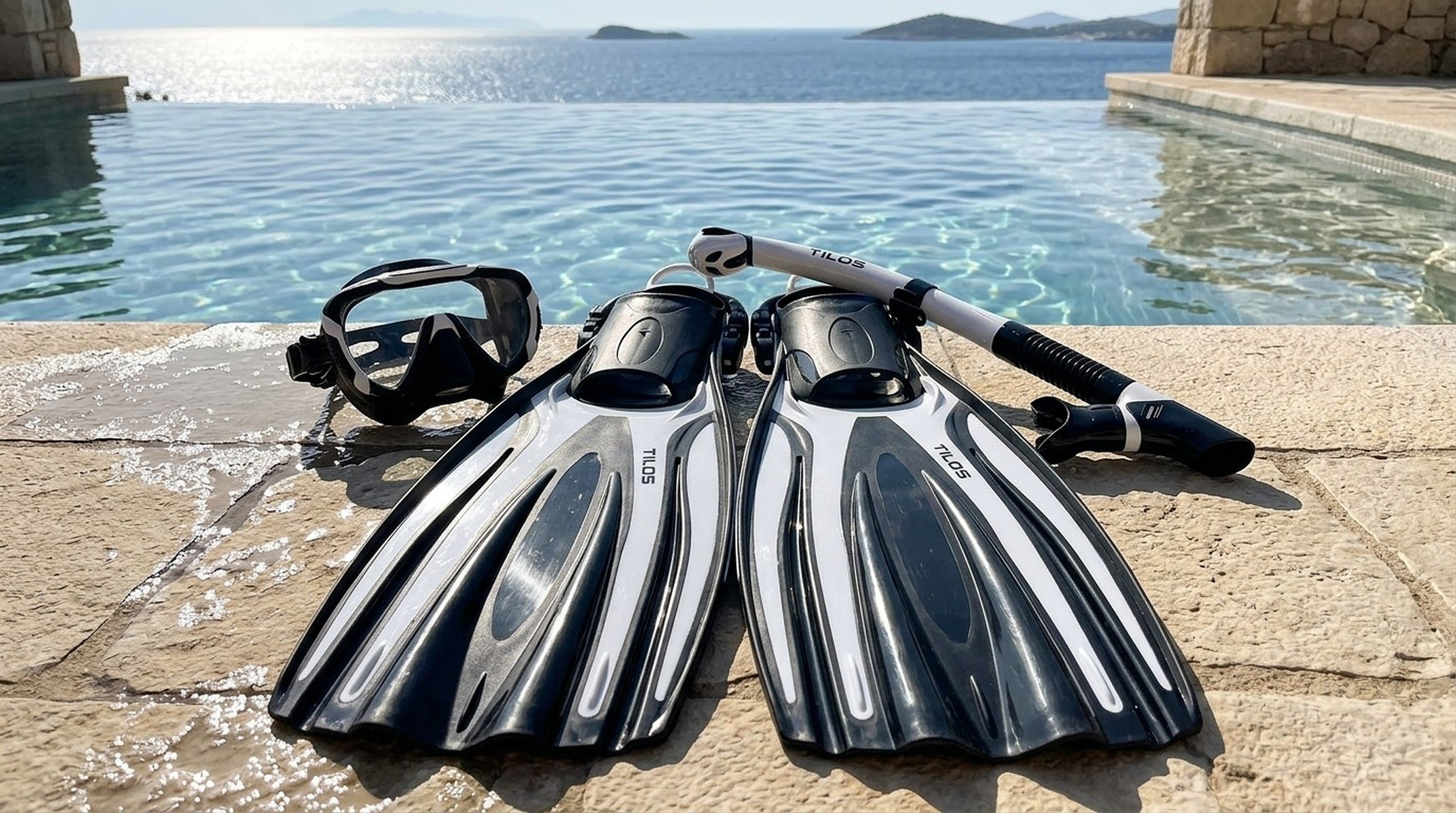 Snorkeler using the Tilos Morphi Mask, Orion Snorkel and Forager Fins Set in Black/White — infinity pool