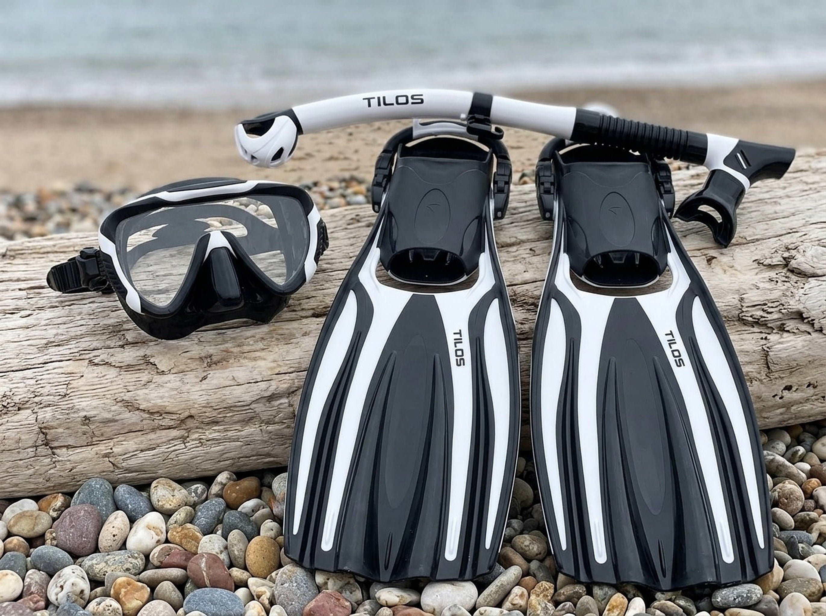 Snorkeler using the Tilos Morphi Mask, Orion Snorkel and Forager Fins Set in Black/White — driftwood