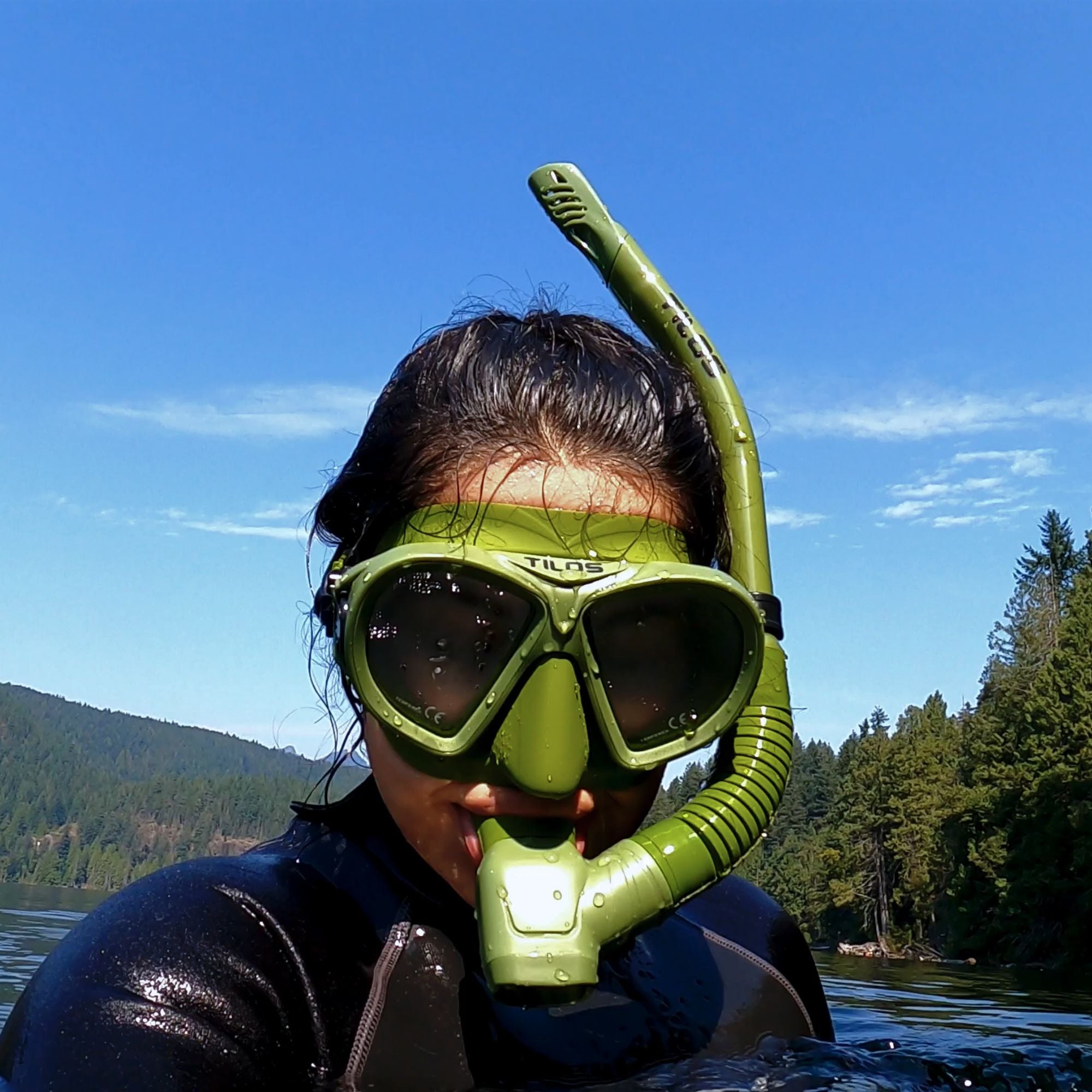 Snorkeler using the Tilos Aquastalk Mask with Hi-Flow II Semi-Dry Snorkel set at the surface