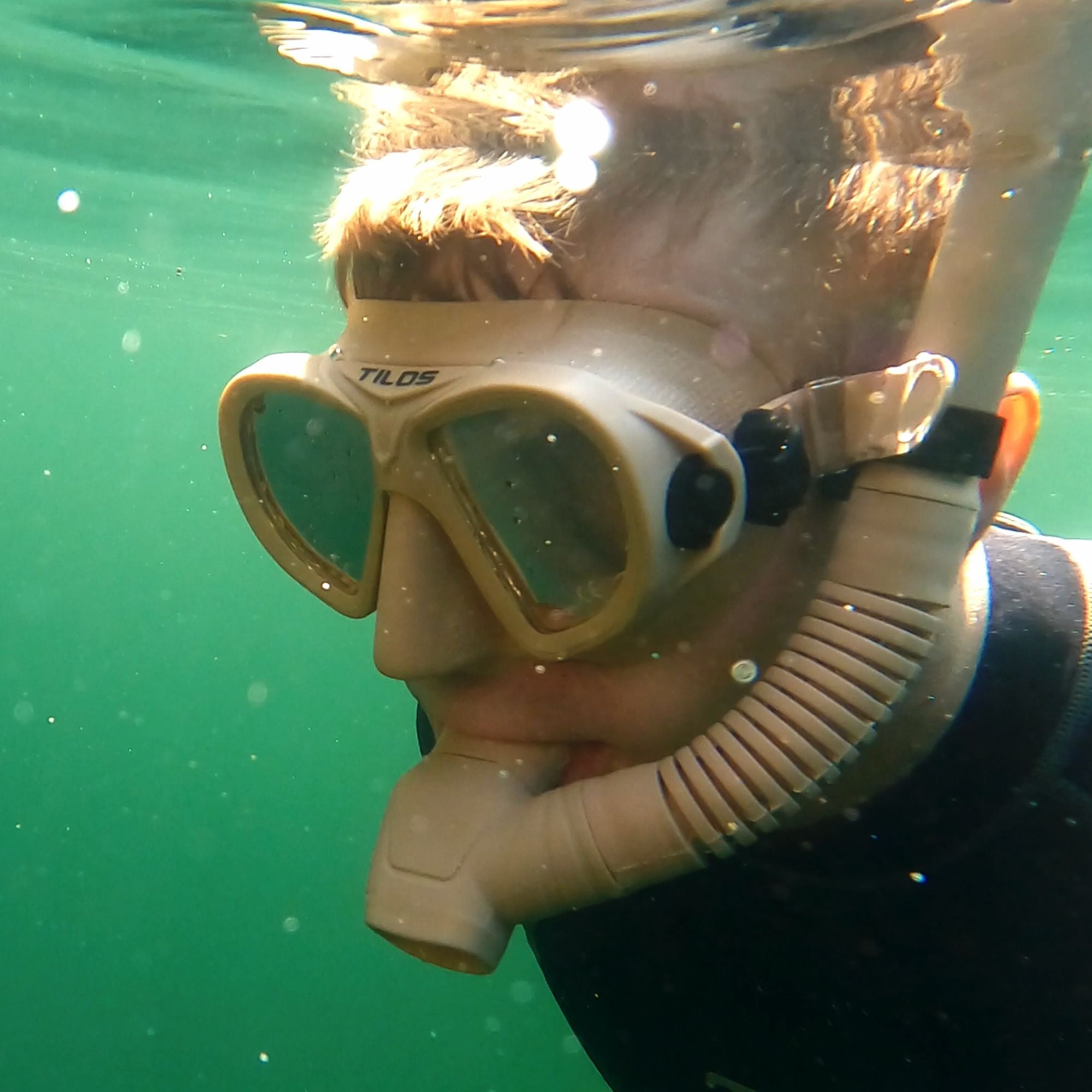 Snorkeler using the Tilos Hi-Flow 2 Semi-Dry Snorkel at the surface