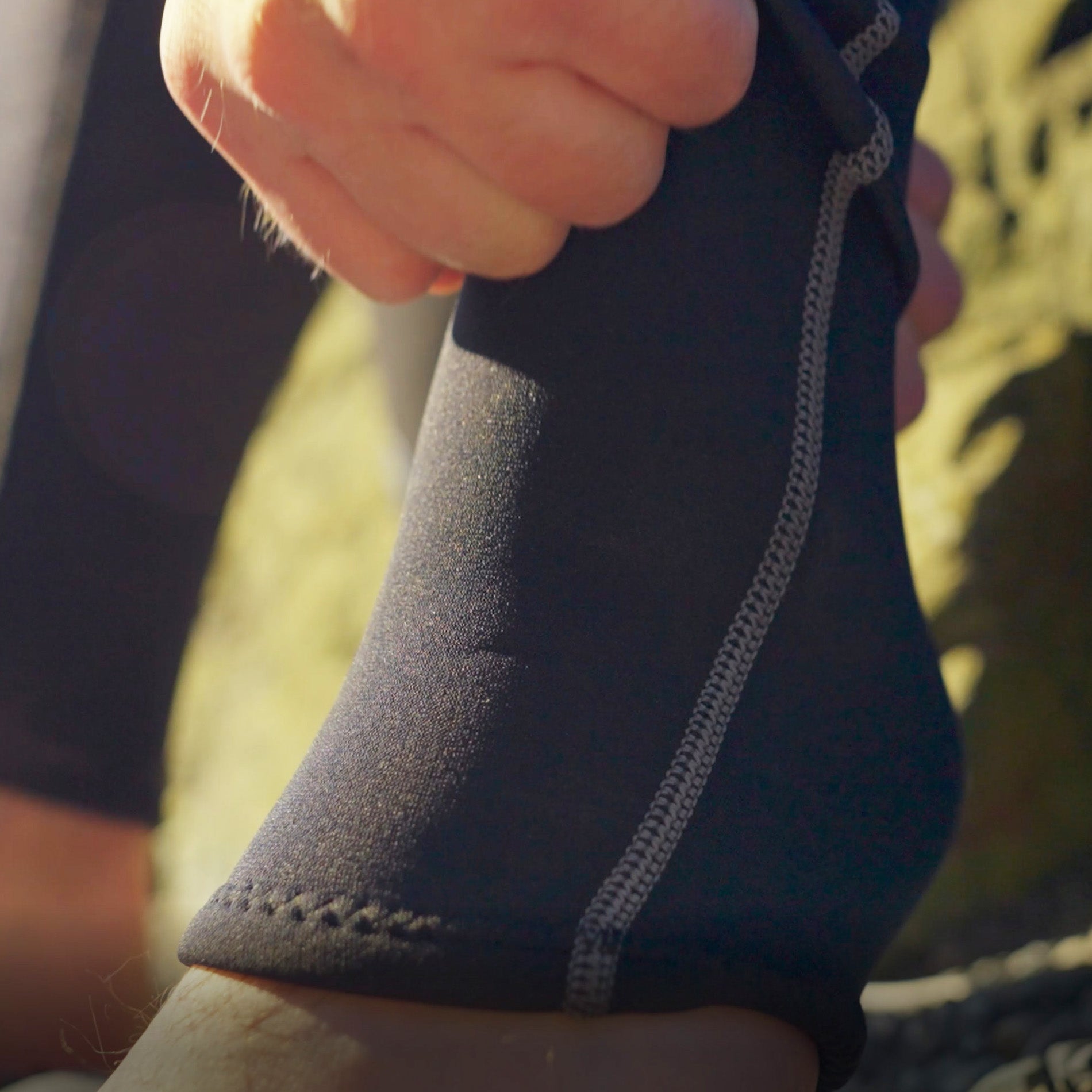 Tilos 3/2mm Jumpsuit — back view showing zipper