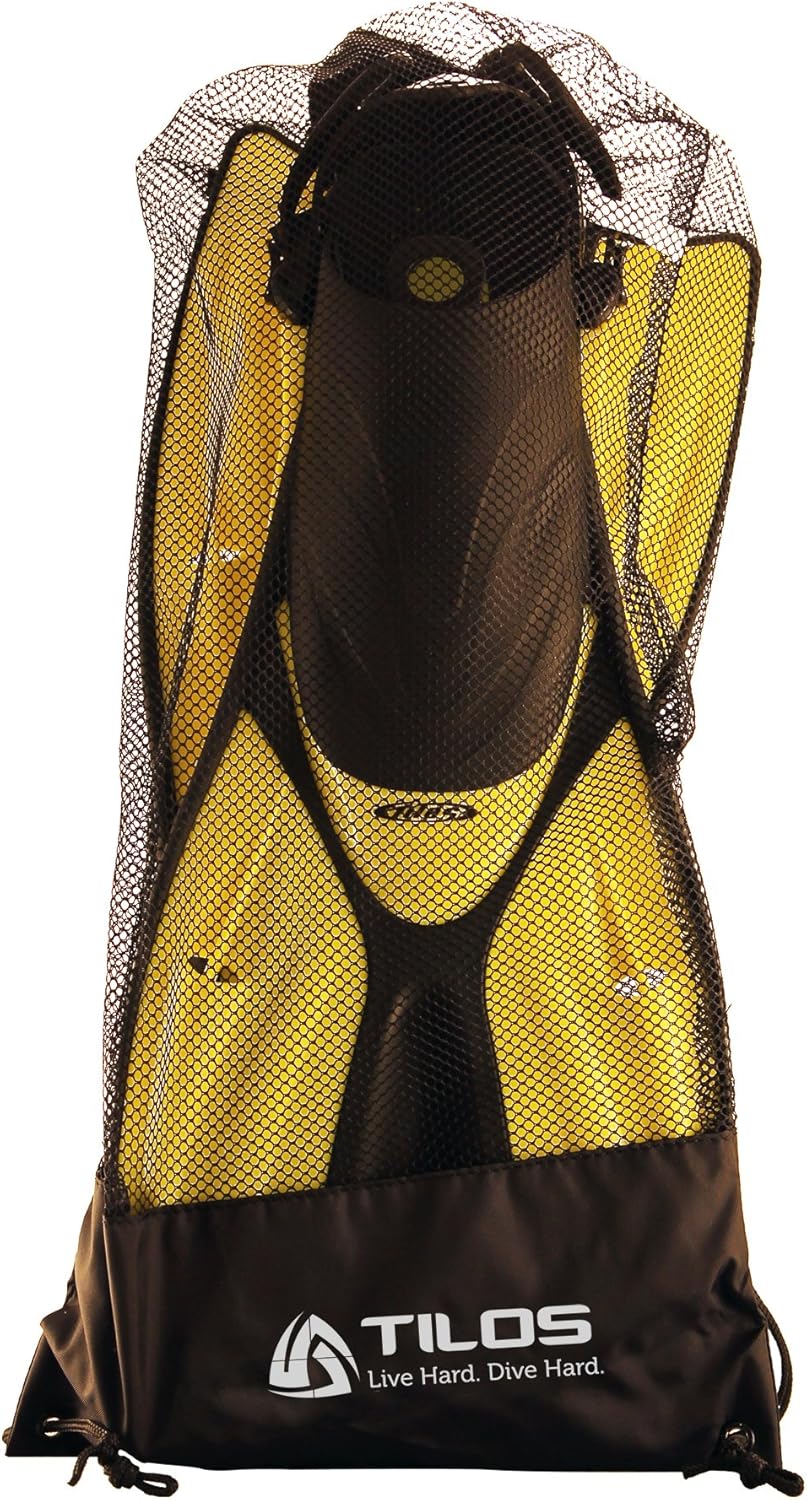 Diver carrying Tilos Getaway Wide Toe Box Snorkeling Fins fins out of the water