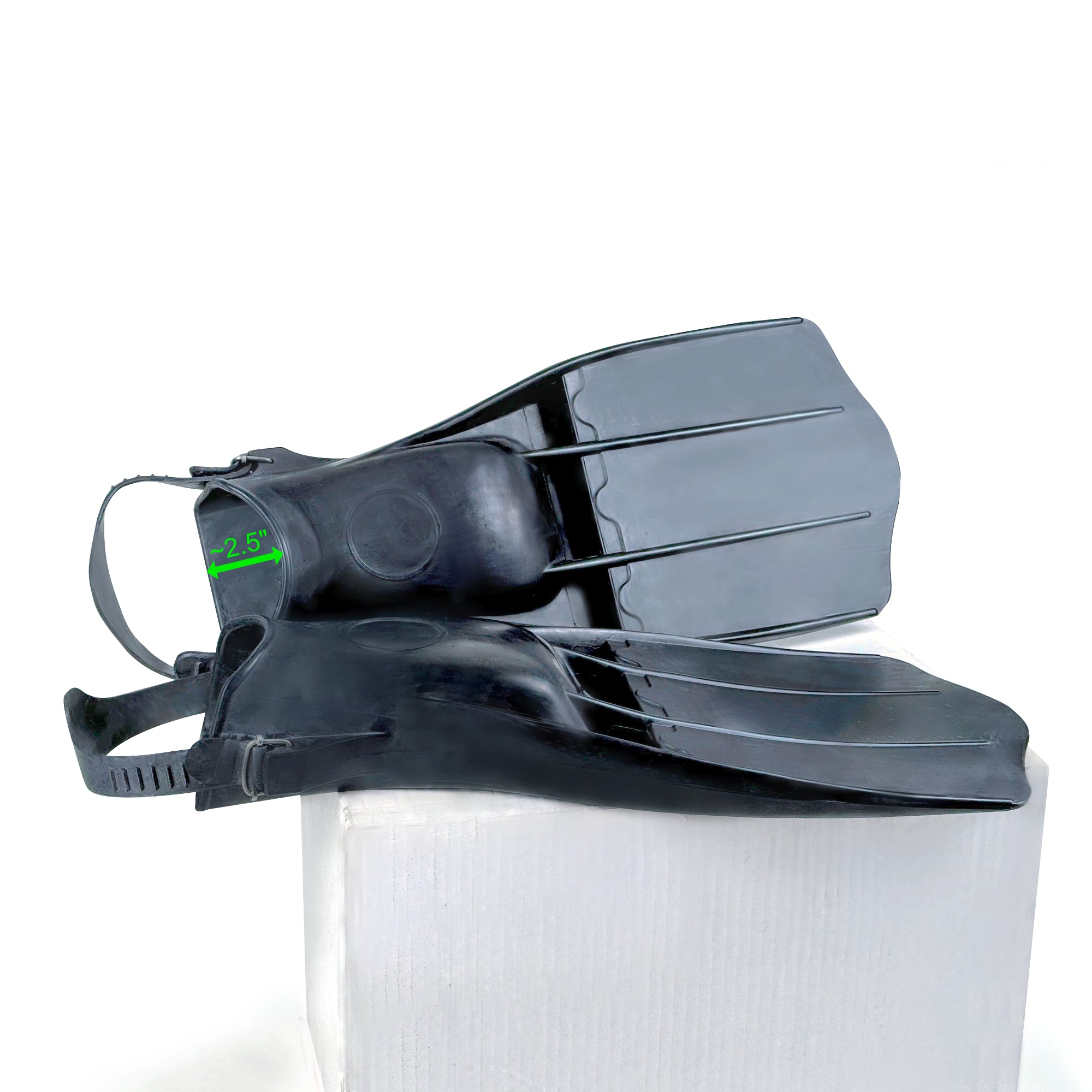 Diver carrying Tilos Classic Rubber Open Heel Fin fins out of the water