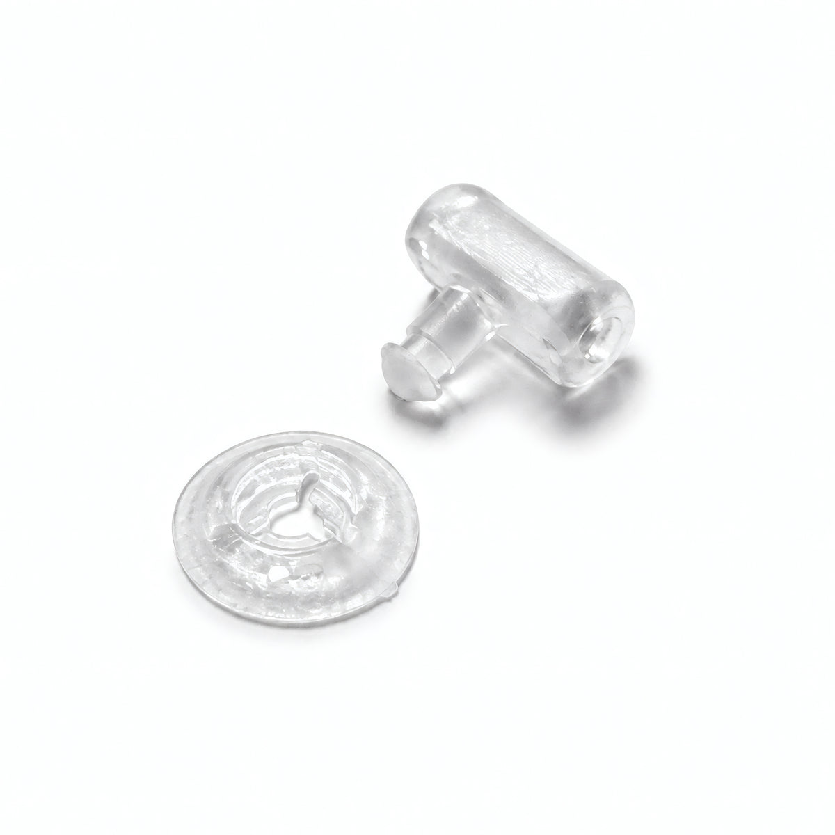 Clear Tilos MA-A mask buckle replacement components, two-piece studio view