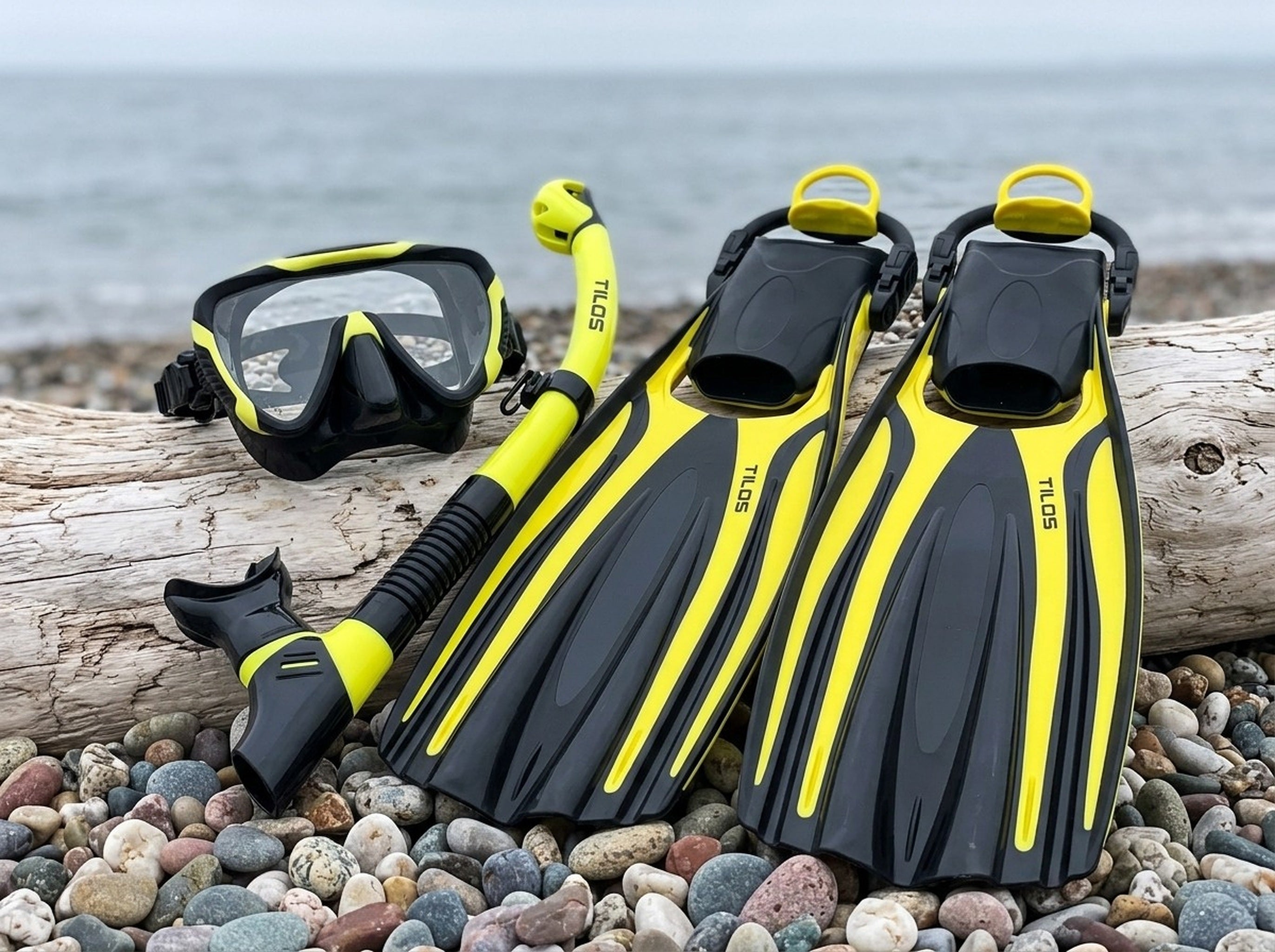 Snorkeler using the Tilos Morphi Mask, Orion Snorkel and Forager Fins Set in Black/Yellow — driftwood