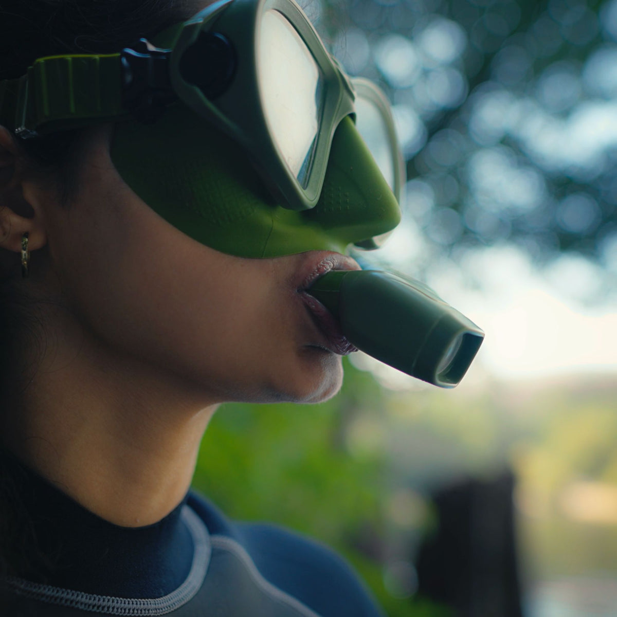 Snorkeler using the Tilos Aquastalk Mask with  Hi-Flow II Semi-Dry Snorkel set at the surface