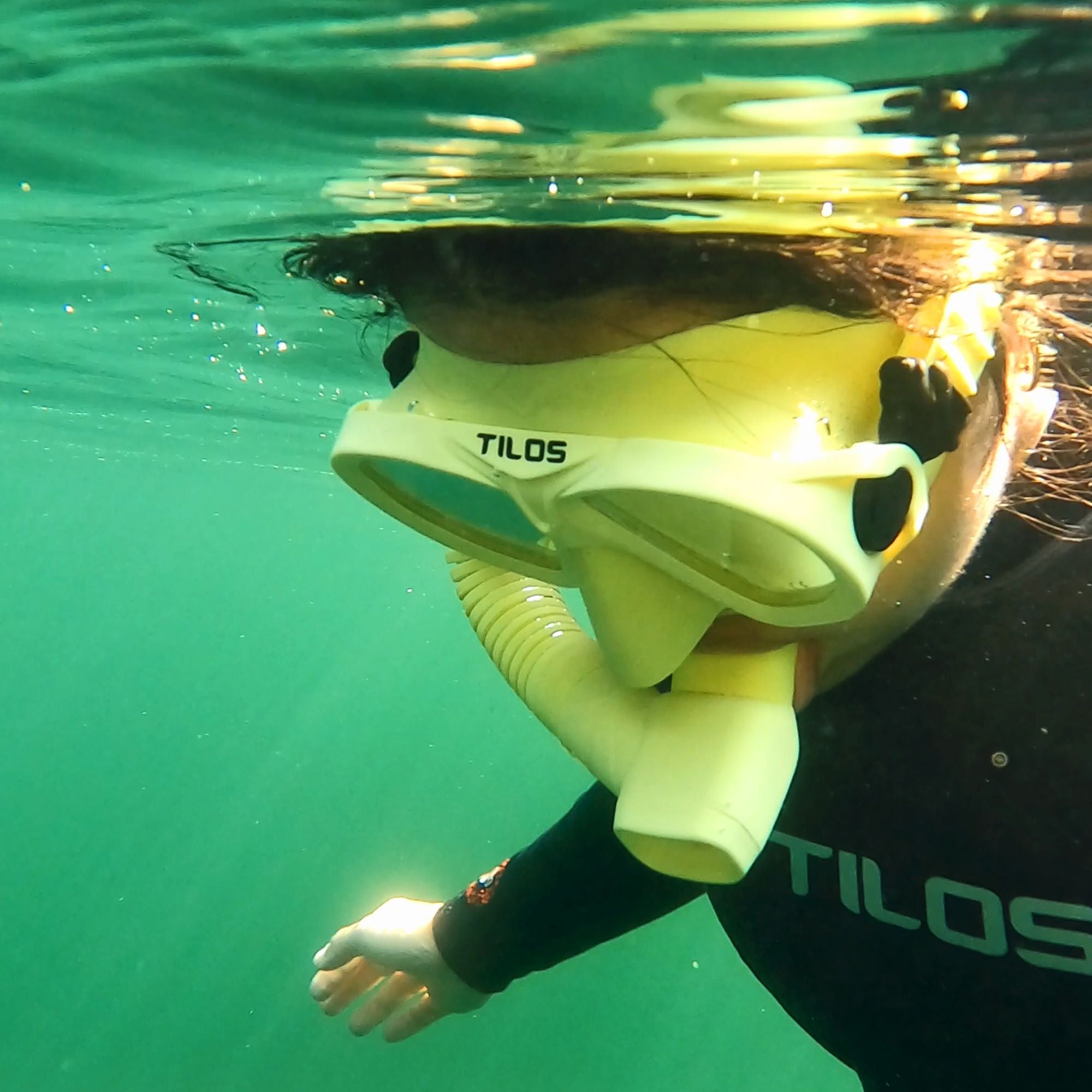 Snorkeler using the Tilos Hi-Flow 2 Semi-Dry Snorkel at the surface